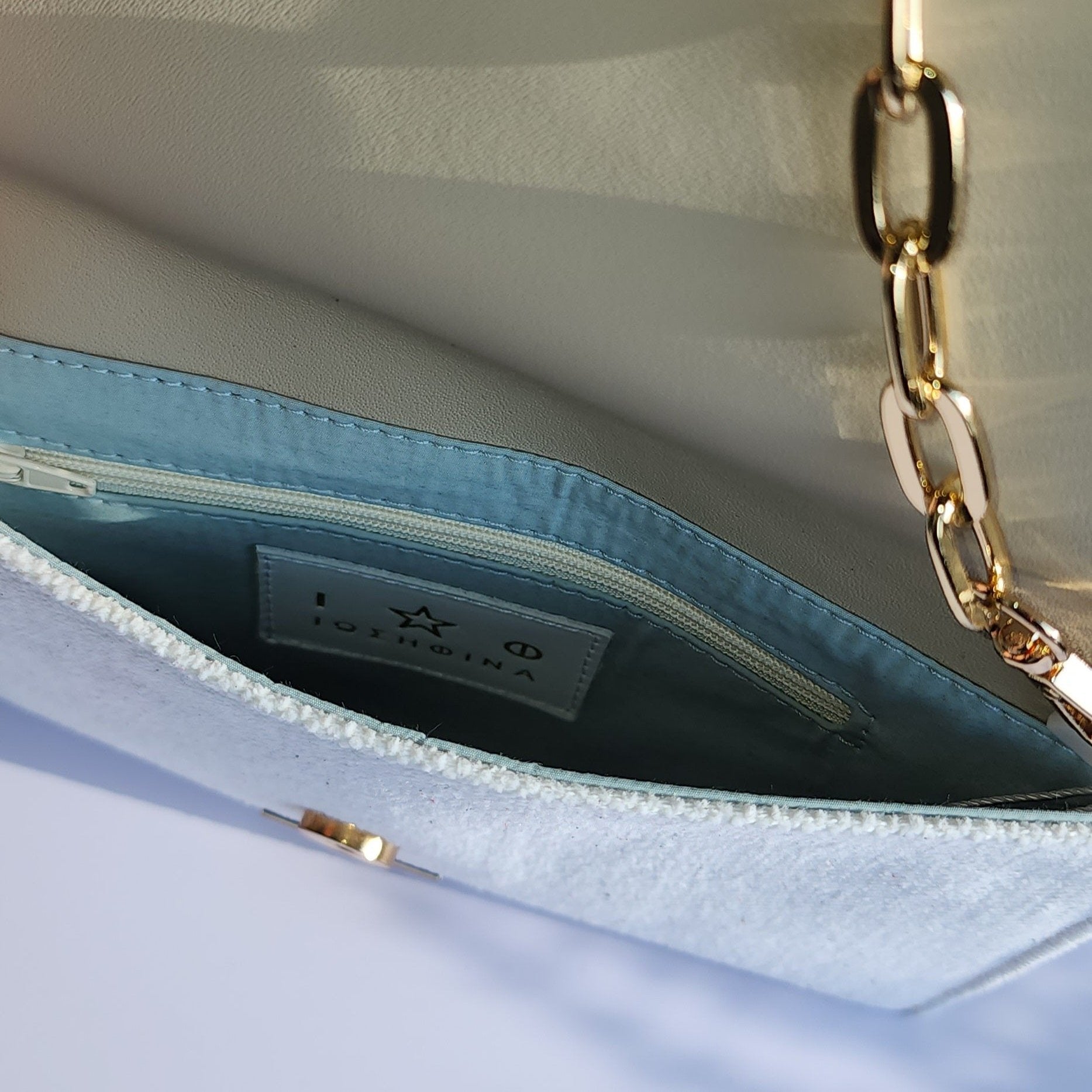 Ikarus Cream Clutch Bag by Iosifina